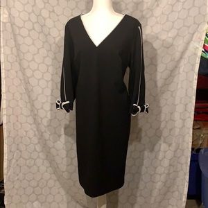 Black crepe dress with white piping details